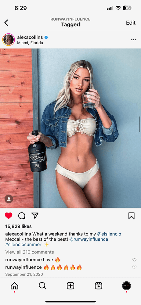 a screenshot of a model wearing a garment and holding a bottle